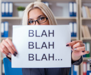Businesswoman with message in office at desk