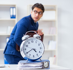 Businessman in bad time management concept