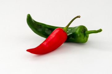 Red and green hot chili peppers isolated on white background, closeup