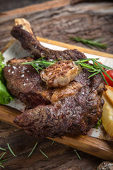 Neck steak, tenderloin or filet mignon pork or beef. Juicy tasty piece of meat. Delicious juicy steak.  A big piece of grilled meat.