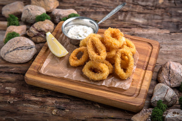 Crunchy Deep fried squid ring in batter with a delicious sauce. Beautiful stylish menu. Autumn...