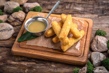 Crunchy Breaded mozzarella cheese sticks with mustard sauce. Beautiful stylish menu. Snack to beer.