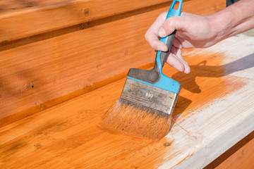 Paint the porch with orange paint. Decorate the terrace. Paint the boards with a wide brush. To...