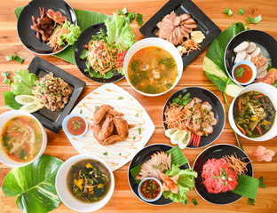 Table food served on plate / Tradition northeast food Isaan delicious on plate with fresh vegetables Many variety various Thai menu Asian food on a wooden table , top view