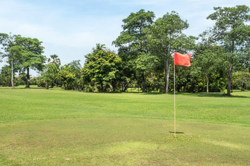 Obraz premium Nature landscape view of golf course green yard fairway with red flag