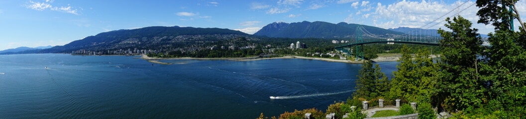 Beautiful Vancouver bay beach and mountain seen from Stanley park