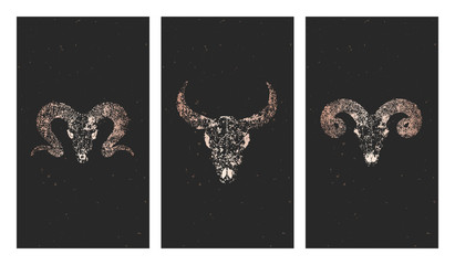 Vector set of three illustrations with gold silhouettes skulls bull, rams and grunge elements on black background.
