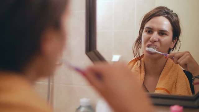 The girls brush their teeth