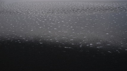 Black sand and water