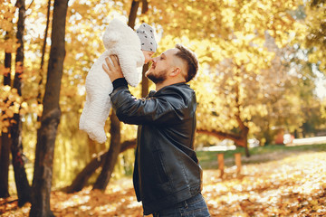 Family with cute son. Father in a black jacket.