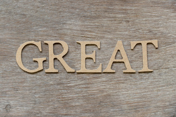 Alphabet letter in word great on wood background