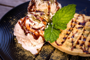 Matcha green tea topping on ice cream with waffle and Chocolate 