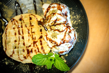 Matcha green tea topping on ice cream with waffle and Chocolate 