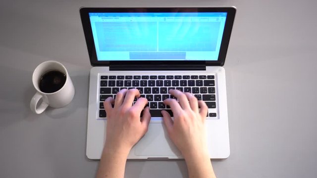 Hands Typing on the Laptop Keyboard