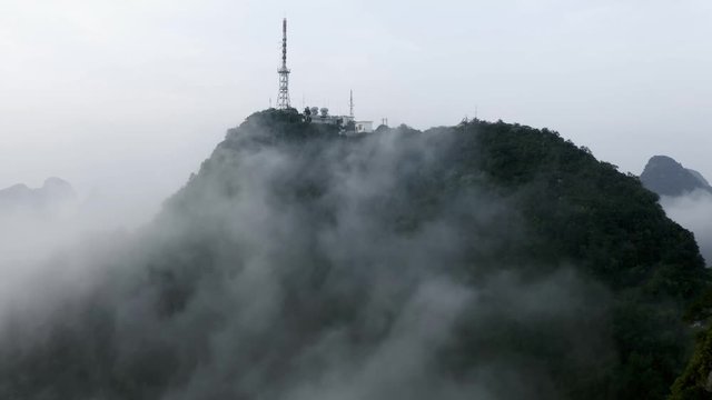 Yangshuo Mountains 4k Drone Pull Back From Tv Tower Above The Misty Clouds