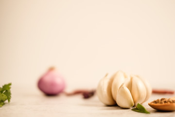 Garlic clove on stone top view .Flat lay composition with herb and nut seed