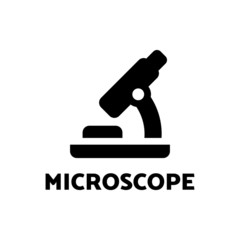 microscope icon in black solid style