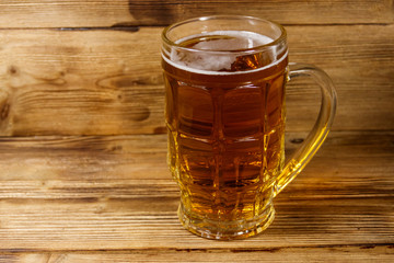 Mug of beer on a wooden table