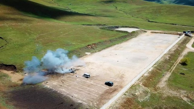 2010s - Cars in a remote location are blown up by a US Army bomb squad.