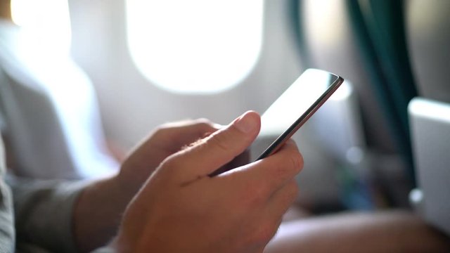 Online banking with smart phone. Lifestyle. Easy pay using mobile phone or digital device. Communication app or Woman shopping online on or working while sitting in plane on business travel.