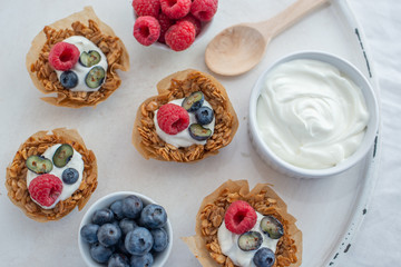 healthy home made granola cups with greek yogurt and berries