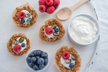 healthy home made granola cups with greek yogurt and berries