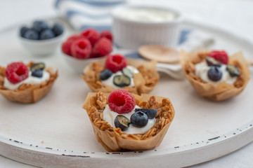 healthy home made granola cups with greek yogurt and berries