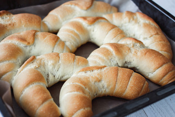 fresh crusty bread rolls in a wheat leaven