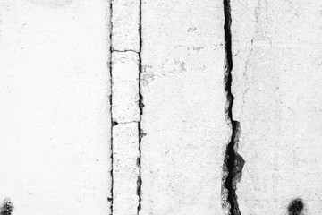 Texture of a concrete wall with cracks and scratches which can be used as a background