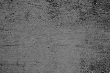 Texture of a concrete wall with cracks and scratches which can be used as a background