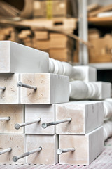 Balusters process production. Solid wood balusters before finishing. Furniture manufacture. Close-up