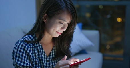 Woman use of mobile phone at night