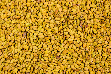 Background of the fenugreek seeds (methi dana, helba or shambala)