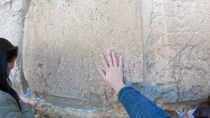 Jewish women and girls is praying in front of wailing wall