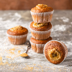 Homemade banana muffins on a gray background. Healthy vegan dessert. Close-up selective focus.