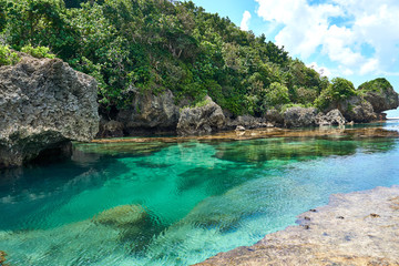 Fototapeta na wymiar Philippines, Siargao Island, 22.July.2019.: Tourists visit magpupungko natural rock pools in Siargao, Philippines.
