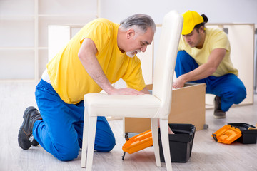 Two contractors carpenters working indoors