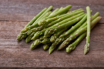Seasonal product fresh green Asparagus on dark background