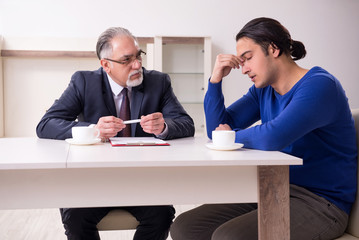 Male real estate agent and male client in the apartment