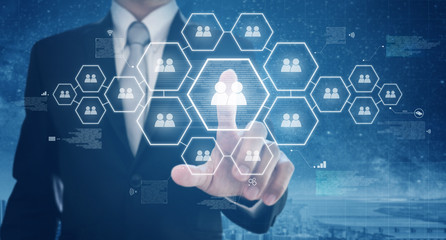Business human resource and social networking. Businessman pushing human icon on screen