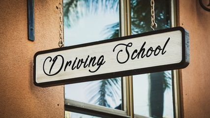 Naklejka premium Street Sign DRIVING SCHOOL
