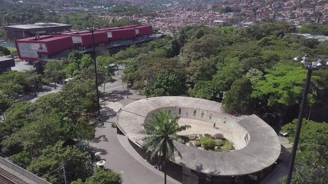 4k aerial ascending shot of Park Explora and Botanical garden in summer day, Medellin