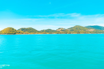 Looking at the Island, blue water and sky.