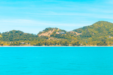 Fototapeta premium Looking at the Island, blue water and sky.