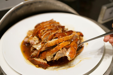 Grilled Peking duck - A plate of homemade roasted duck, Chinese food style.