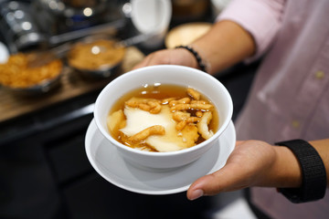 Homemade tofu pudding with ginger syrup, Chinese traditional dessert, Popular in Thailand.