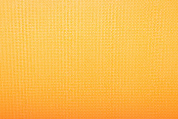 The texture of Karimat, an orange yoga mat. Can be used as wallpaper, background, texture.