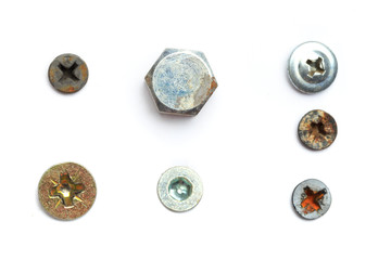 Screw heads, nuts, rivets isolated on white.