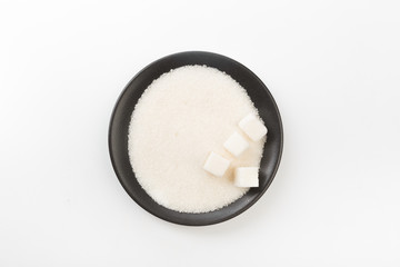 Bowl of sugar isolated on white background, top view - Image