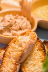 Roasted bread ciabatta and herring cream cheese in background